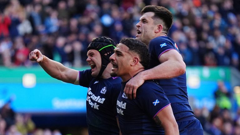 Scotland's Darcy Graham celebrates scoring a try with team-mates during the Guinness Men's Six Nations