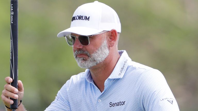 Paul Waring checks the lie of the 17th green during the first round of the Texas Children's Houston Open 