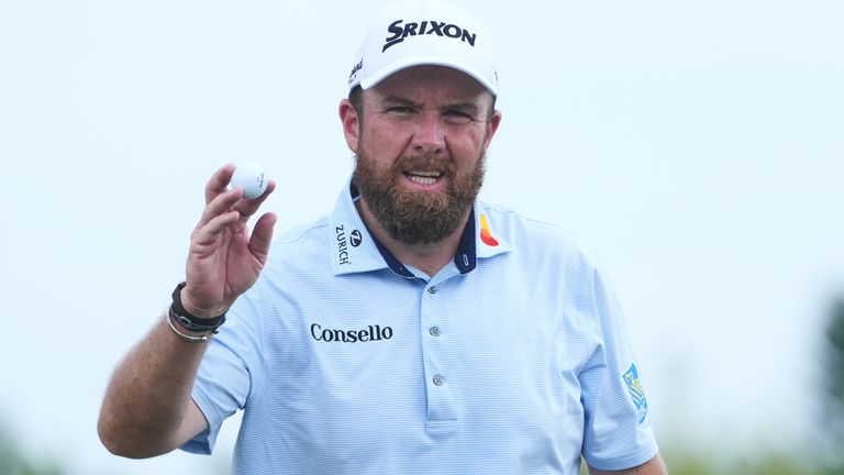 Shane Lowry of Ireland shows his ball on the 18th green during the third round of the Cognizant Classic