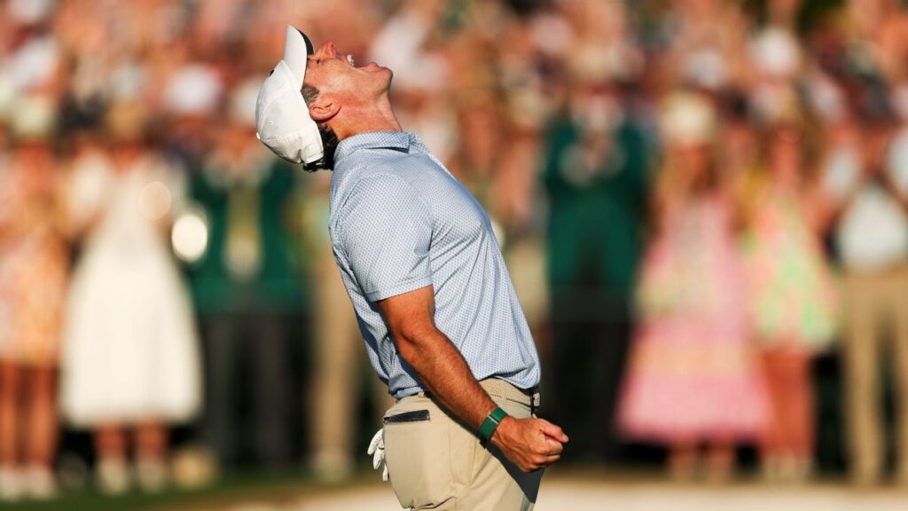 Rory McIlroy receives congratulations after winning second straight Masters
