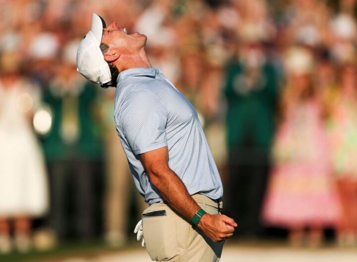 Rory McIlroy receives congratulations after winning second straight Masters